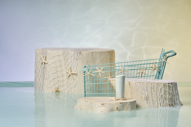 SmoothSip Slider styled in front of a teal shopping cart, half-submerged in water
